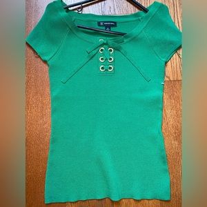 Green top with rhinestone and bow detail